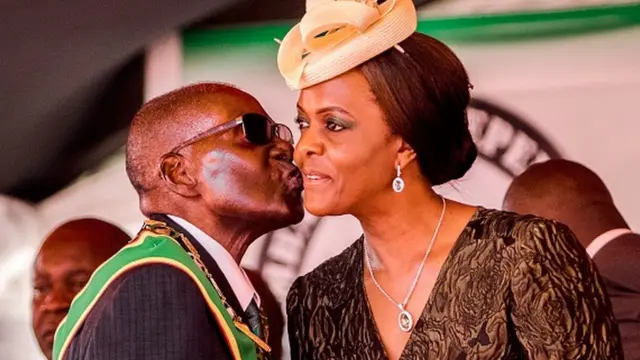 President Robert Mugabe dey kiss im wife Grace