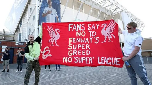 Fans protest outside Elland Road stadium against Liverpool's decision to be included amongst the clubs attempting to form a new European Super League