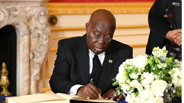 Ghana's President Nana Akufo-Addo signing a book of condolences for the Queen