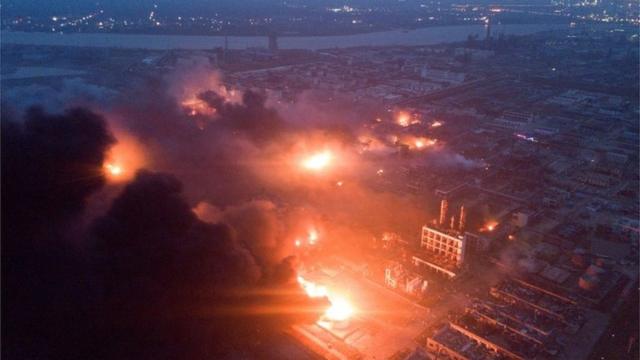 Overhead view of the Tianjiayi Chemical plant on fire with smoke billowing