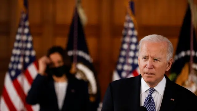 Joe Biden speaks at Emory University in Atlanta, GA as Kamala Harris looks on 19 March 2021