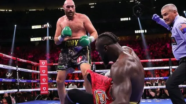 Tyson Fury knocks down Deontay Wilder