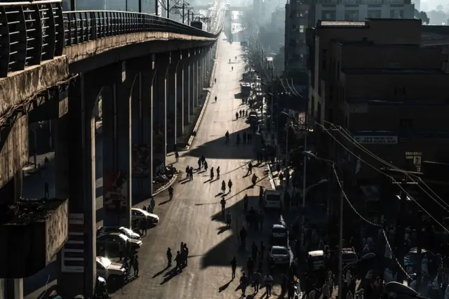 People walk along a street