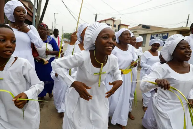 Nigerian Celestial Church of Christ members attend a Palm Sunday procession in Anthony Village, Lagos, Nigeria April 10, 2022.
