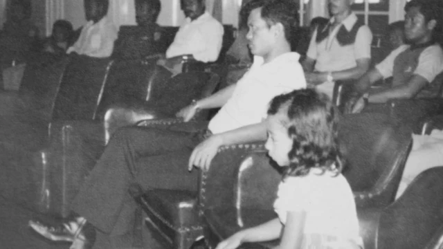 Nina with the soldier who took her sitting through mass at the chapel.