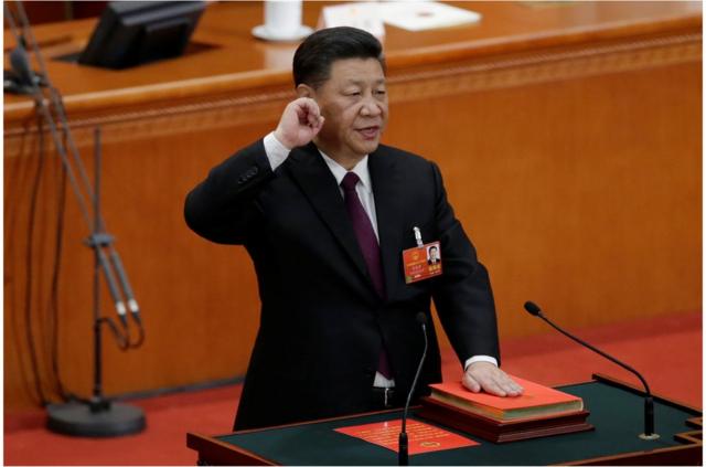 2018年3月17日，习近平获全票赞成连任中国国家主席和中央军委主席（图为习近平在十三届全国人大会议上宣誓）。