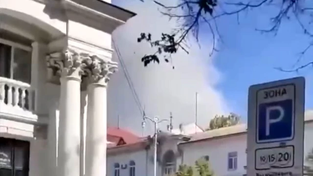 Grab from video showing smoke billowing from building