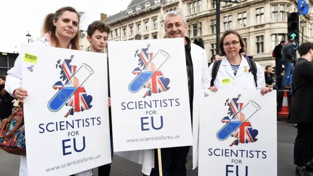 People with placrads "Scientists for EU" attend the "Put it to the People" march in London, Britain, 23 March 2019.