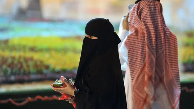 Saudi woman with Saudi man