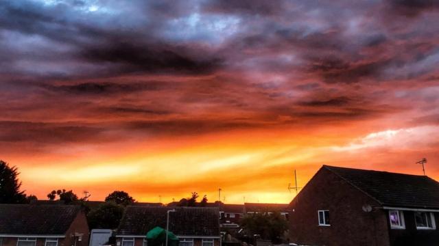 Spectacular pink and orange sunset lights up sky - BBC News