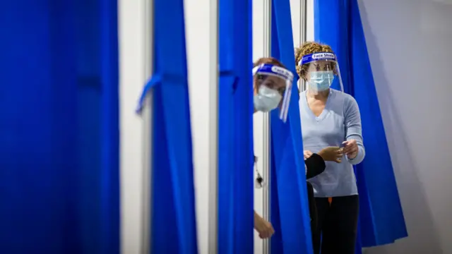 Staff are seen inside the Melbourne Exhibition Centre COVID-19 Vaccination Centre on 28 May 2021 in Melbourne, Australia