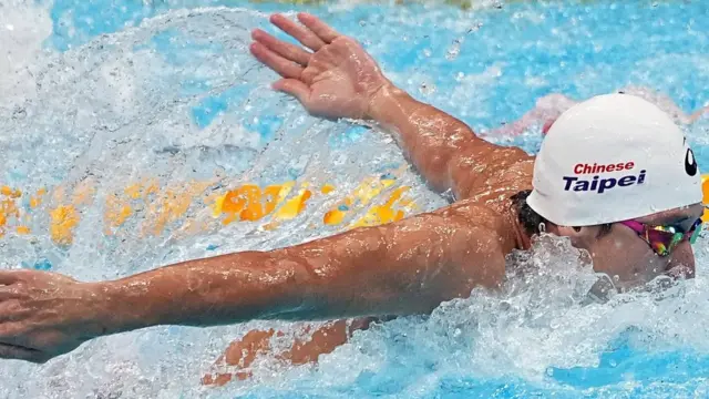 东京水上运动中心东京奥运男子100米蝶泳初赛中华台北选手王冠闳比赛中（29/7/2021）