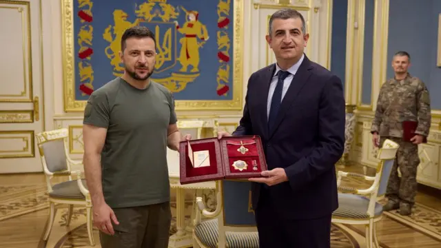 Ukraine President Volodymyr Zelenskiy award Haluk Bayraktar, CEO of Turkish drone-maker Baykar, with di Order of Merit