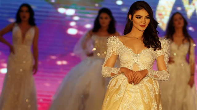 Tunisian beauty queen contestant Ahlem Souidi poses on stage in Tunis, Tunisia - Tuesday 10 March 2020