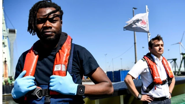 Workers at Antwerp Port show their wristbands