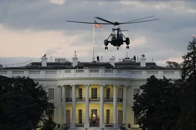 Marine One helicopter carrying the president lands on the White House lawn
