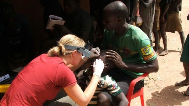 Dr Anna Last examining a patient for trachoma