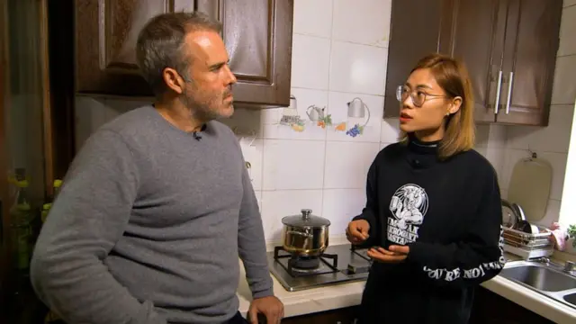 The BBC's Robin Brant talking with Pan Rung Ping.