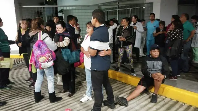 People gather outside a hospital in Mexico City after the quake