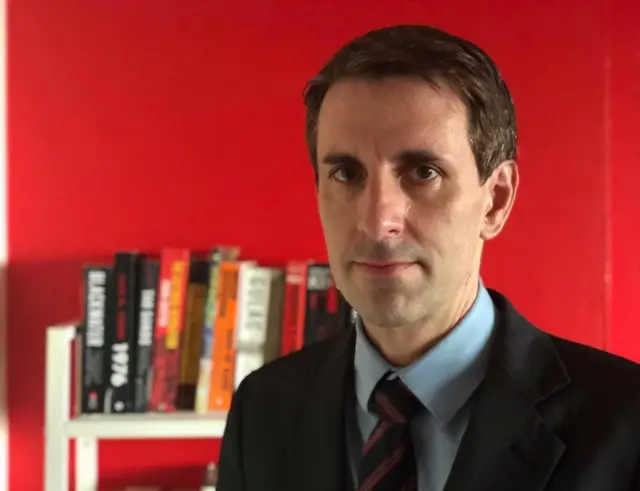 นายจอร์จ แม็คคลาวด์ ผู้เชี่ยวชาญด้านวิเคราะห์ความเสี่ยงทางการเมือง