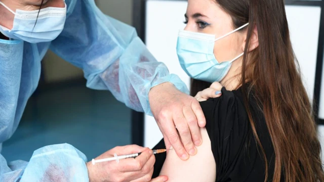 A student is vaccinated with the Astra-Zeneca Covid-19 vaccine in France. 12 March.
