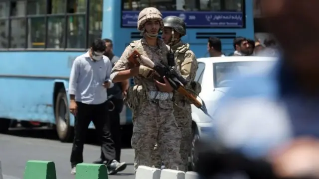 Iranian army soldiers stand near parliament building during an attack in Tehran, Iran, 07 June 2017