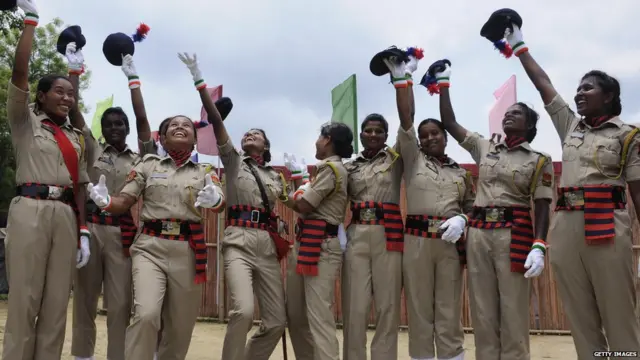 Indian police personnel celebrate after a passing out ceremony at a police training academy in Agartala on May 11, 2017.