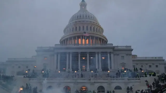 Supporters of Donald Trump clash with police officers in front of the US Capitol