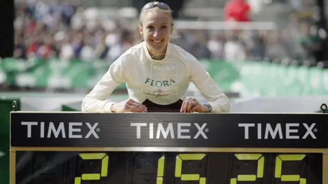 Paula Radcliffe of Great Britain with the womens elite trophy after winning the 2003 Flora London Marathon on April 13, 2003