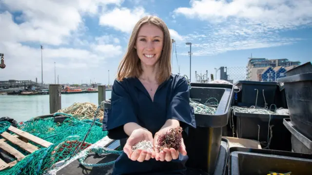 Lucy holding the materials