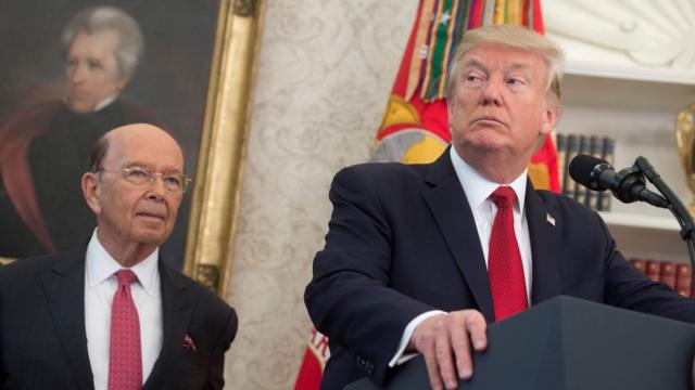 US President Donald Trump speaks alongside Secretary of Commerce Wilbur Ross (L) about his tax reform proposal prior to meeting with winners of the National Minority Enterprise Development Week Awards Program in the Oval Office of the White House in Washington, DC, October 24, 2017