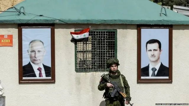 पुतिन और बशर अल असद की तस्वीरें