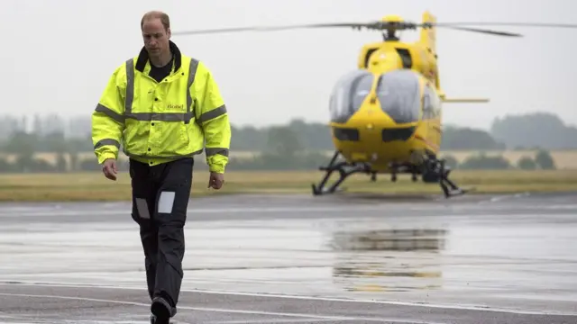 Prince William walks away from his helicopter