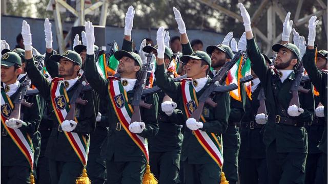 Iranian elite revolutionary guards march during an annual military parade which marks Iran's eight-year war with Iraq, in the capital Tehran on September 22, 2011.