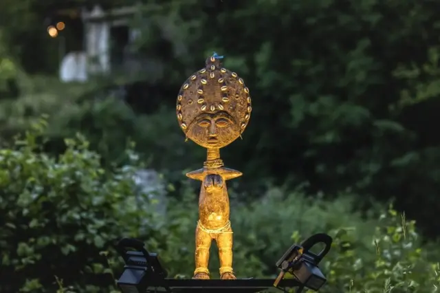 A stage prop stands on the stage floor.