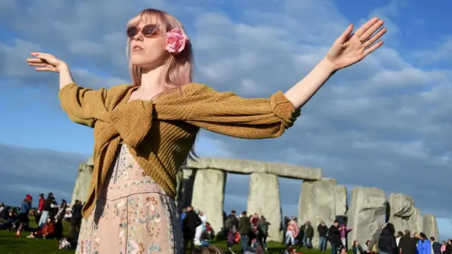 Visitors celebrate summer solstice and the dawn of the longest day of the year at Stonehenge on June 21, 2019 in Amesbury, England.