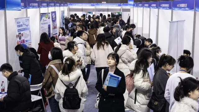 University students attend a job fair in Wuhan, in central China's Hubei province on March 6, 2024