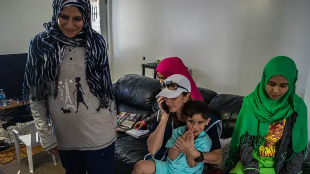 Ms Lapierre meets with a family of Syrian refugees in Saint-Jerome