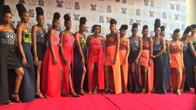 Fine lady dem wey be hostesses inside the event hall for Eko Hotel