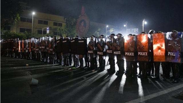 Police officers stand in formation during an anti-government protest, in Bangkok, Thailand, March 20, 2021
