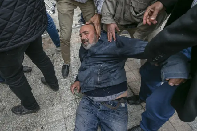 Tunisian security forces intervene in people, who gathered for sit-in protest against Tunisian President Kais Saied's 'extraordinary decisions' in Tunis, Tunisia on December 18, 2021
