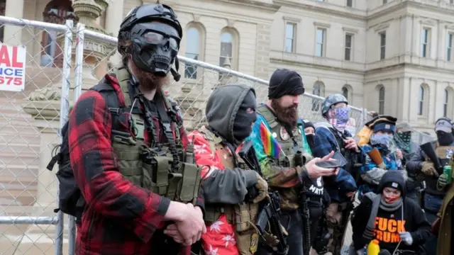 Members of the Boogaloo Bois protest against the election of President-elect Joe Biden, outside the Michigan State Capitol in Lansing, Michigan