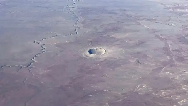 The Meteor Crater near Winslow, Arizona, is seen from a plane Januray 30, 2017. The Meteor Crater, sometimes known as the Barringer Crater and formerly as the Canyon Diablo crater, is a famous impact crater. It is the breath-taking result of a collision between an asteroid traveling 26,000 miles per hour and planet Earth approximately 50,000 years ago. Meteor Crater is nearly one mile across, 2.4 miles in circumference and more than 550 feet deep.