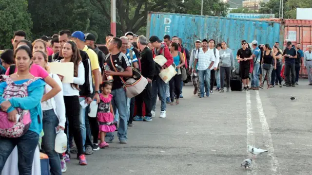 Venezuelan citizens cross from their country to Colombia, through the Simon Bolivar International Bridge, in Cucuta, Colombia