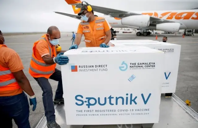 Workers take care of the shipment of Russia"s Sputnik V vaccine in Caracas, Venezuela March 29, 2021