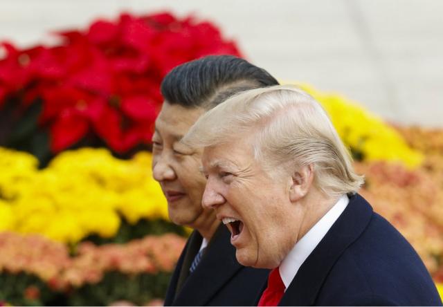 U.S. President Donald Trump takes part in a welcoming ceremony with China's President Xi Jinping on November 9, 2017 in Beijing, China. Trump is on a 10-day trip to Asia. (Photo by Thomas Peter-Pool/Getty Images)