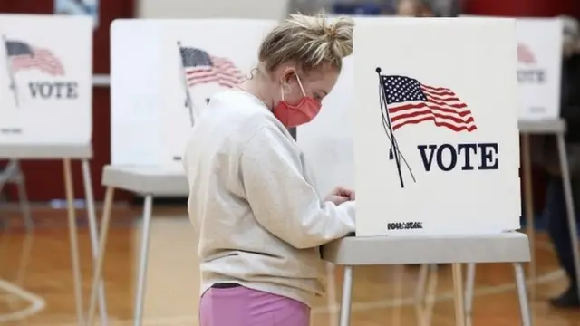 A woman fills out her ballot at Stamping Ground Elementary in Stamping Ground, Kentucky on 3 November