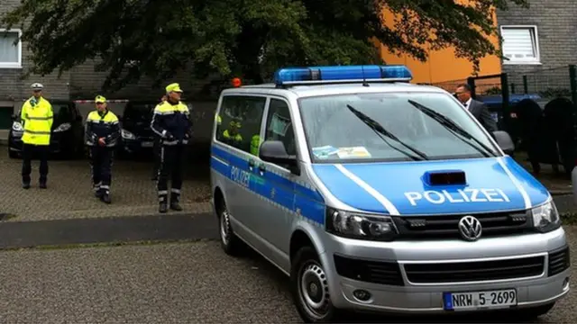 Police officers at a residential building where the bodies of five children were found in the western town of Solingen, Germany, 3 September 2020