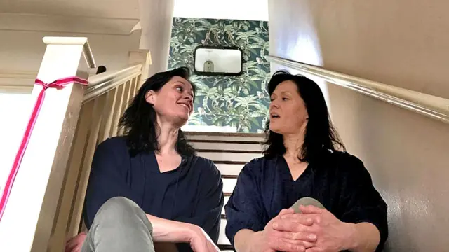 Kate Walsh has a word with herself sitting on the stairs (montage)