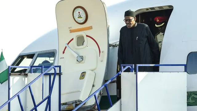 Picture of president Muhammadu Buhari coming down from an aeroplane.